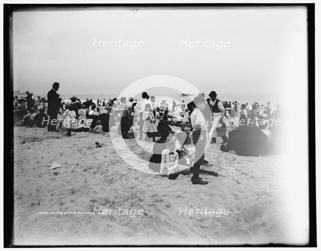On the beach at Coney Island, between 1901 and 1906. Creator: Unknown.