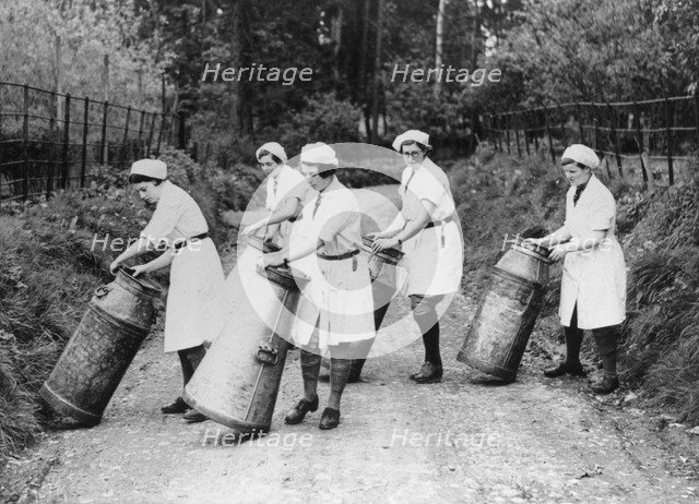 Women churning milk, c1940s(?). Artist: Unknown