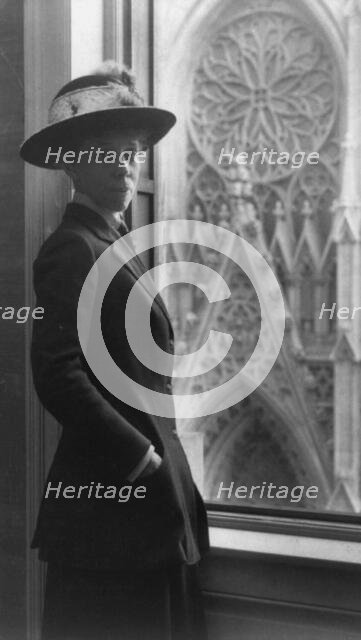 Woman standing by window, 3/4 lgth., facing slightly right, overlooking cathedral door, n.d.. Creator: Frances Benjamin Johnston.