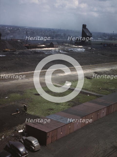 C & NW RR railroad workers cultivating a little Victory garden at Proviso yard, Chicago, Ill., 1943. Creator: Jack Delano.