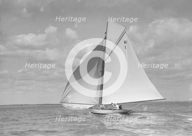 'Norman' (H1), an early 8 Metre class yacht sailing downwind, 1911. Creator: Kirk & Sons of Cowes.