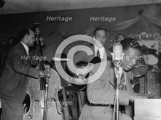 Portrait of Wesley Prince, Oscar Moore, and Nat King Cole, Zanzibar, New York, N.Y., ca. July 1946. Creator: William Paul Gottlieb.