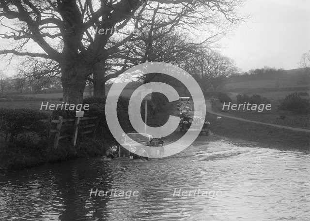 972 cc Singer Le Mans driving through water during a motoring trial, 1936. Artist: Bill Brunell.