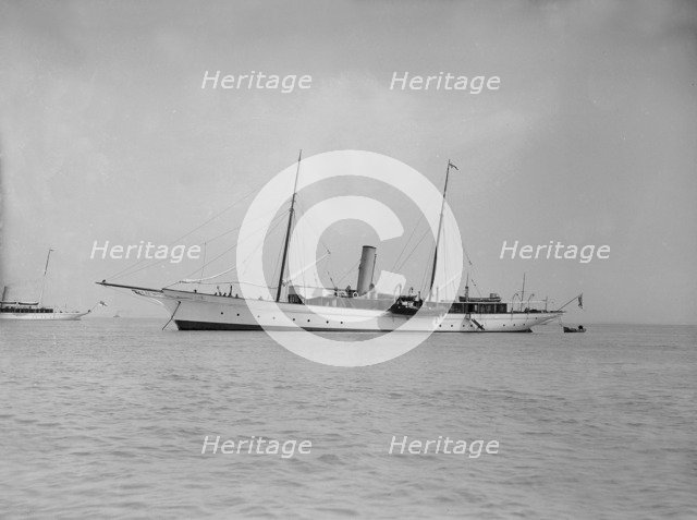 The steam yacht 'Agatha' at anchor, 1911. Creator: Kirk & Sons of Cowes.