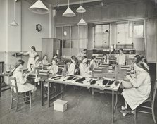 Hair dressing class, Barrett Street Trade School for Girls, London, 1915. Artist: Unknown.