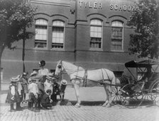 Children studying a horse and buggy outside the Tyler School, Washington, D.C., (1899?). Creator: Frances Benjamin Johnston.