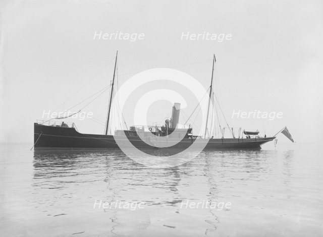 The 116 ton steam yacht 'Athena' at anchor, 1911. Creator: Kirk & Sons of Cowes.