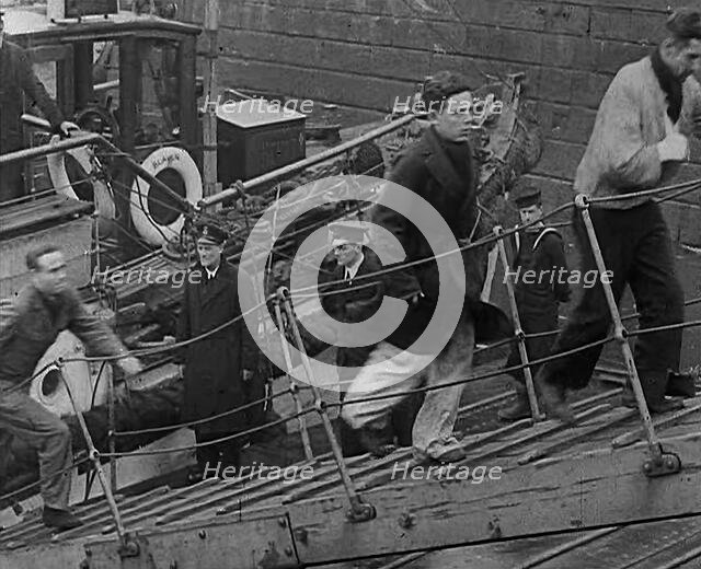 Crew of the Destroyed Bismarck Walking up a Gangplank Into a British Ship, 1943. Creator: British Pathe Ltd.