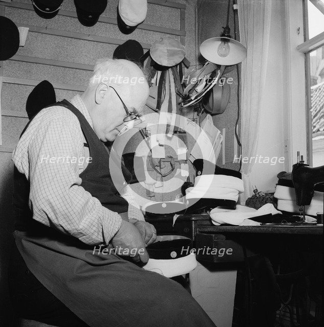 A hatter making a cap, Landskrona, Sweden, 1949. Artist: Unknown