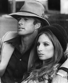 Barbara Streisand (1942-), American singer and actress with Robert Redford (1937-), 1973. Artist: Unknown