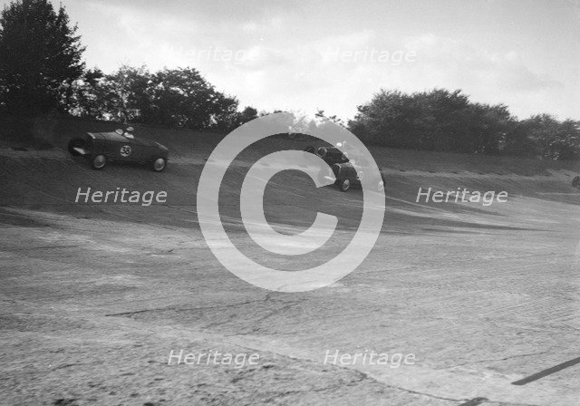 John Cobb and Tim Rose-Richards' Talbot 105s, BRDC 500 Mile Race, Byfleet Banking, Brooklands, 1931. Artist: Bill Brunell.