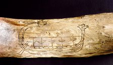 A Norse ship incised on a piece of wood.