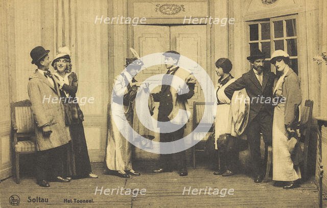 Actors, some in drag, performing at a prisoner of war camp in Belgium, (between 1910 and 1919?). Creator: Unknown.