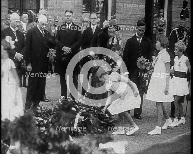 Young Girls Leaving Flowers in a Pile for Wilhelmina, Her Majesty the Queen of the Netherlands,1930s Creator: British Pathe Ltd.