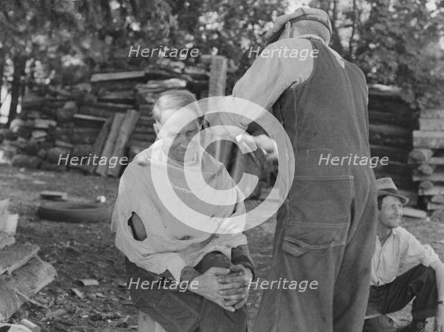 Bean pickers barbering each other, near West Staten, Marion County, Oregon, 1939. Creator: Dorothea Lange.