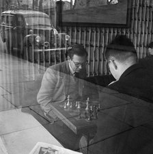 Men playing chess in a cafe, Hampstead, London, 1962-1964. Artist: John Gay