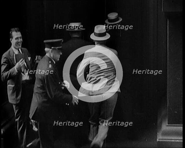 Male Civilians Walking in to a Building, 1929. Creator: British Pathe Ltd.