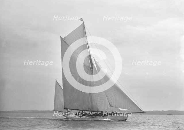 The 30 ton yawl 'Palmosa' under sail, 1911. Creator: Kirk & Sons of Cowes.