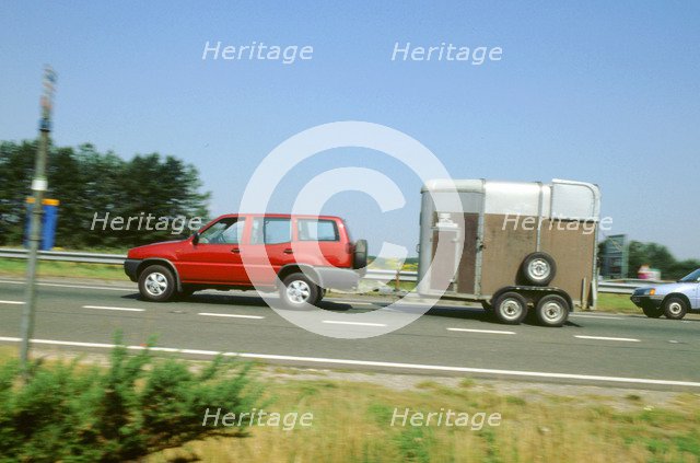 1997Ford Maverick towing horse box. Artist: Unknown.