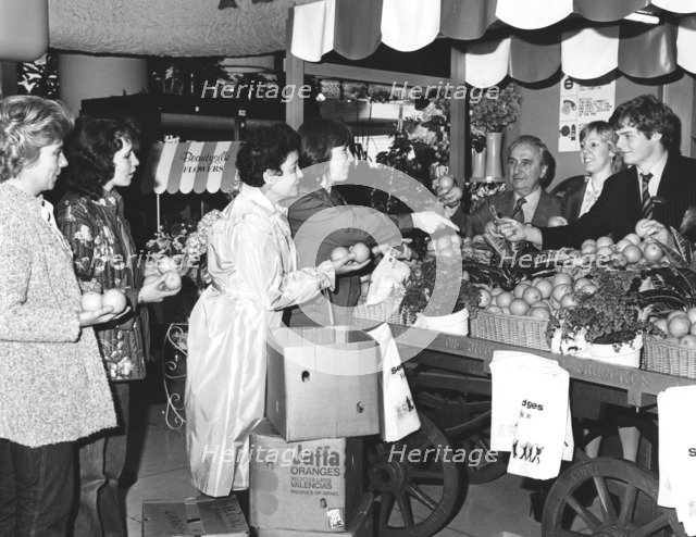 Buying Israeli Jaffa oranges for charity at Selfridges, London, 1981. Artist: Sidney Harris