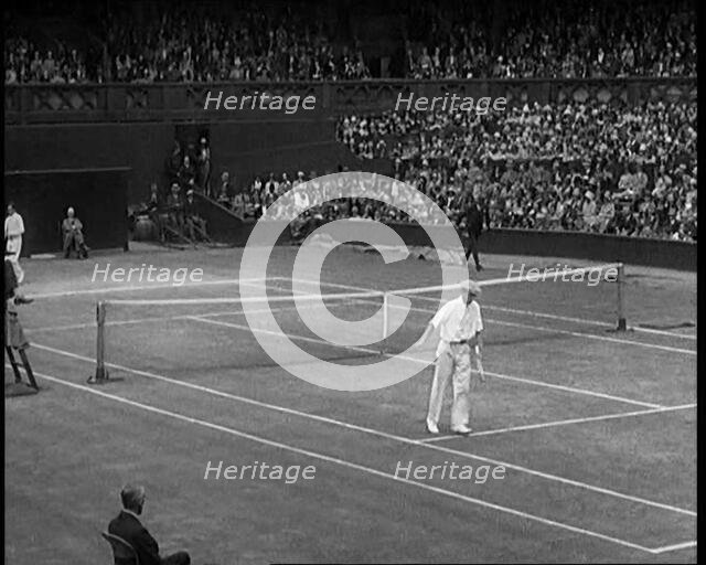 Two Male Civilians Playing a Match of Tennis at Centre Court at the All England Lawn Tennis..., 1920 Creator: British Pathe Ltd.