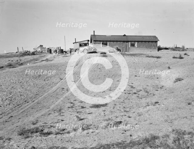 The Browning home, a partial dugout, Dead Ox Flat, Malheur County, Oregon, 1939. Creator: Dorothea Lange.