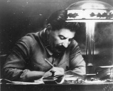 Soviet leader Josef Stalin in his Kremlin study, Moscow, USSR, 1935. Artist: Unknown