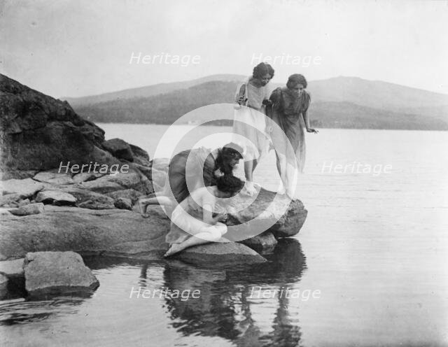 Four figures at water edge, c1914. Creator: Frances Benjamin Johnston.