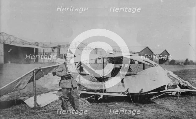 German guarding wrecked aeroplane, between 1914 and c1915. Creator: Bain News Service.