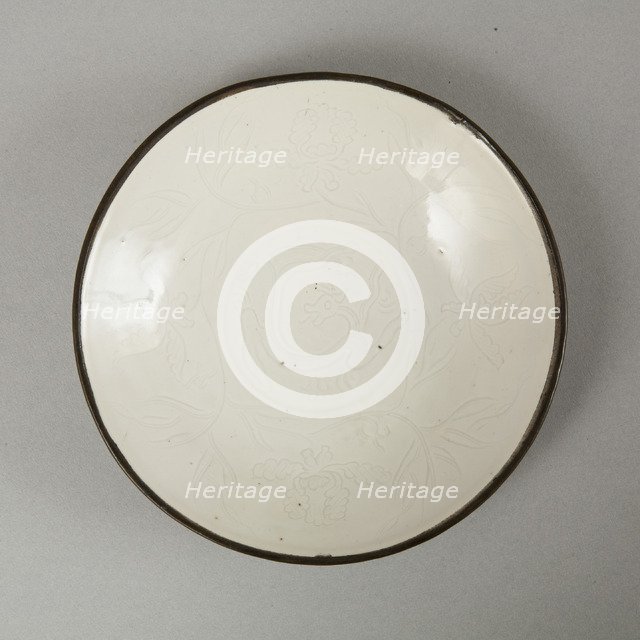 Small Ding-type bowl with incised peony scroll and dragon, 20th century. Artist: Unknown.