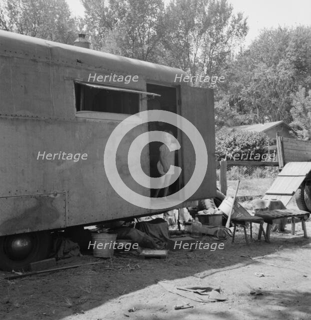 The house trailer and the youngest little girl, Washington, Yakima Valley, Toppenish, 1939. Creator: Dorothea Lange.