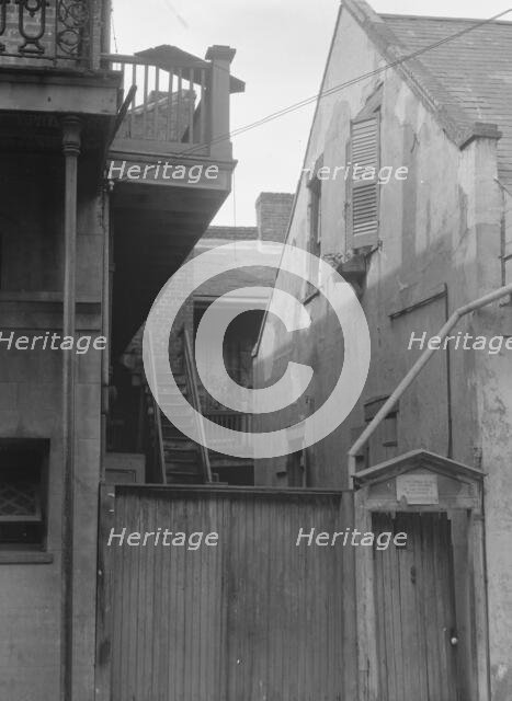 Houses in the French Quarter, New Orleans, between 1920 and 1926. Creator: Arnold Genthe.