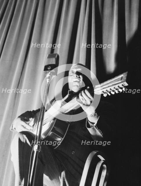 Portrait of Leadbelly, National Press Club, Washington, D.C., 1938. Creator: William Paul Gottlieb.