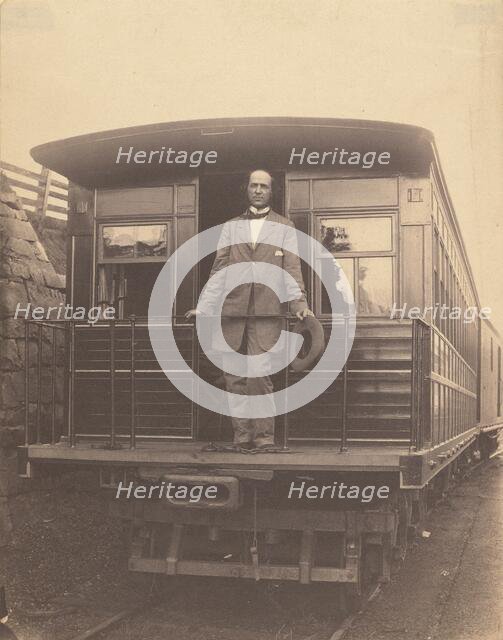 Portrait of an unidentified man standing on rear platform of a train, about 1863. Creator: Unknown.