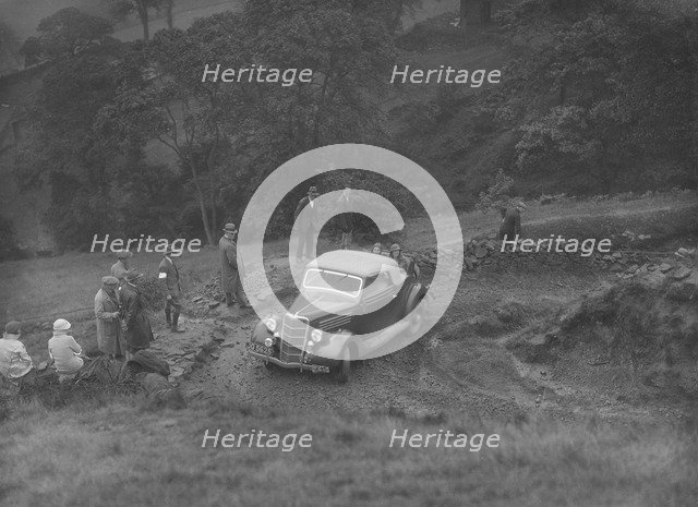 Ford V8 2-seater and dickey of JB Thompson competing in the MCC Sporting Trial, 1935. Artist: Bill Brunell.