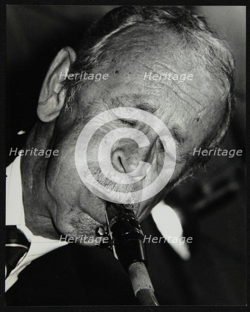 Spike Robinson playing tenor saxophone at The Fairway, Welwyn Garden City, Hertfordshire, 1992. Artist: Denis Williams