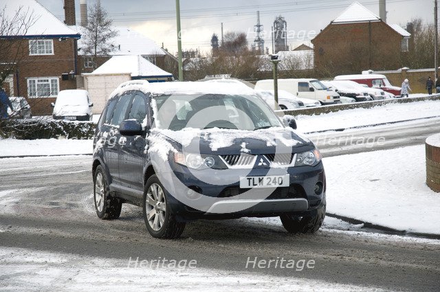 2008 Mitsubishi Outlander driving in snow Artist: Unknown.