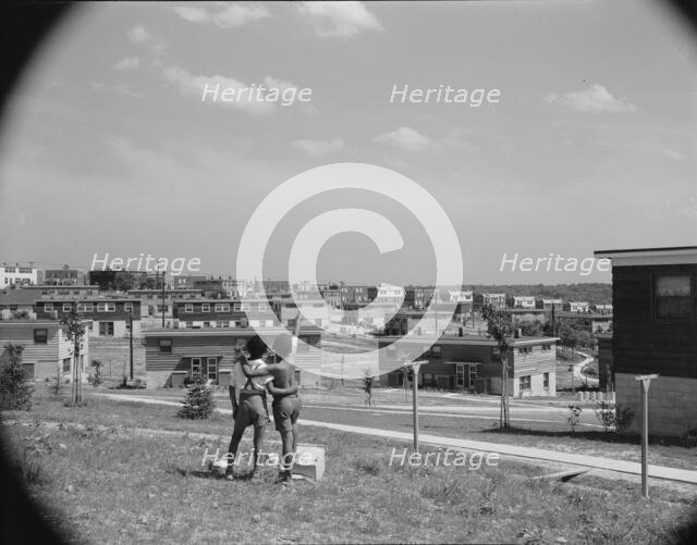 Boys overlooking the project, Frederick Douglass housing project, Anacostia, D.C., 1942. Creator: Gordon Parks.