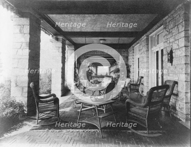 Porch of E.C. Converse house, with wicker furniture, Greenwich, Connecticut, 1908. Creator: Frances Benjamin Johnston.
