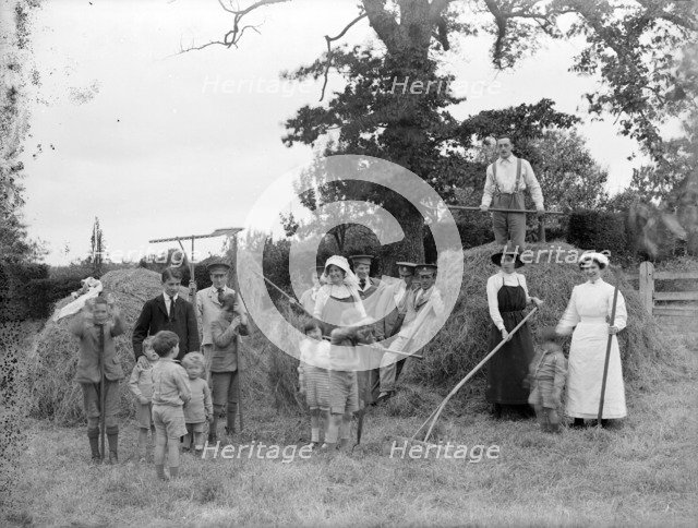 Convalescent soldiers helping women and children with haymaking, Great Dixter, East Sussex, 1916. Artist: Nathaniel Lloyd