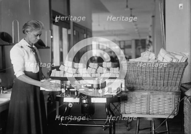 Post Office Department - Opening Machine, 1917. Creator: Harris & Ewing.