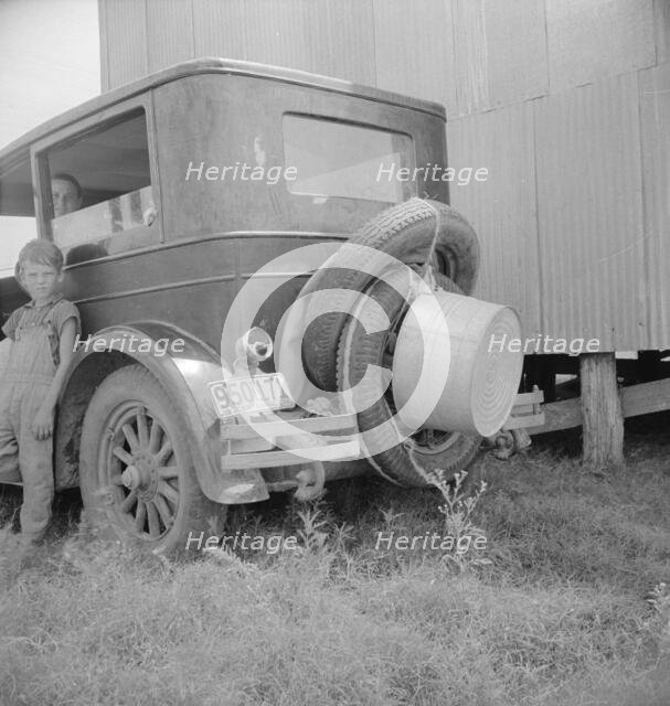 Migrant family's car near Brownsville, Texas, 1936. Creator: Dorothea Lange.