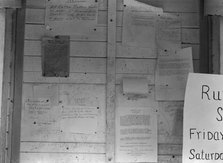 Campers' bulletin board at Shafter camp, California, 1938. Creator: Dorothea Lange.