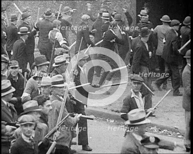 Small Crowd of American Civilians on a Demonstration/Strike in Conflict with the Police, 1930. Creator: British Pathe Ltd.