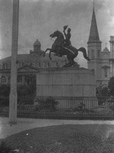 Jackson monument in Jackson Square with the Cabildo and St. Louis Cathedral, New Orleans, c1920-26. Creator: Arnold Genthe.