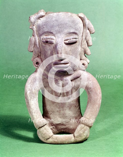 Pre-Colombian Mexican seated pottery figure. Artist: Unknown