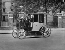 A motor cab and driver, London, c1900. Artist: York & Son
