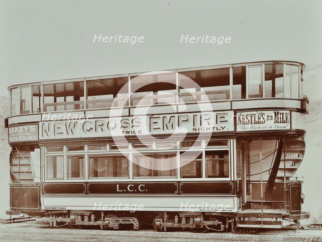 Double-decker electric tram with advertisement for the New Cross Empire, 1907. Artist: Unknown.