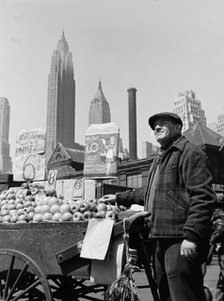 Push cart fruit vendor at the Fulton fish market, New York, 1943. Creator: Gordon Parks.