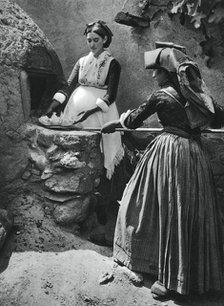Women at the oven, Sardinia, Italy, 1937.Artist: Martin Hurlimann